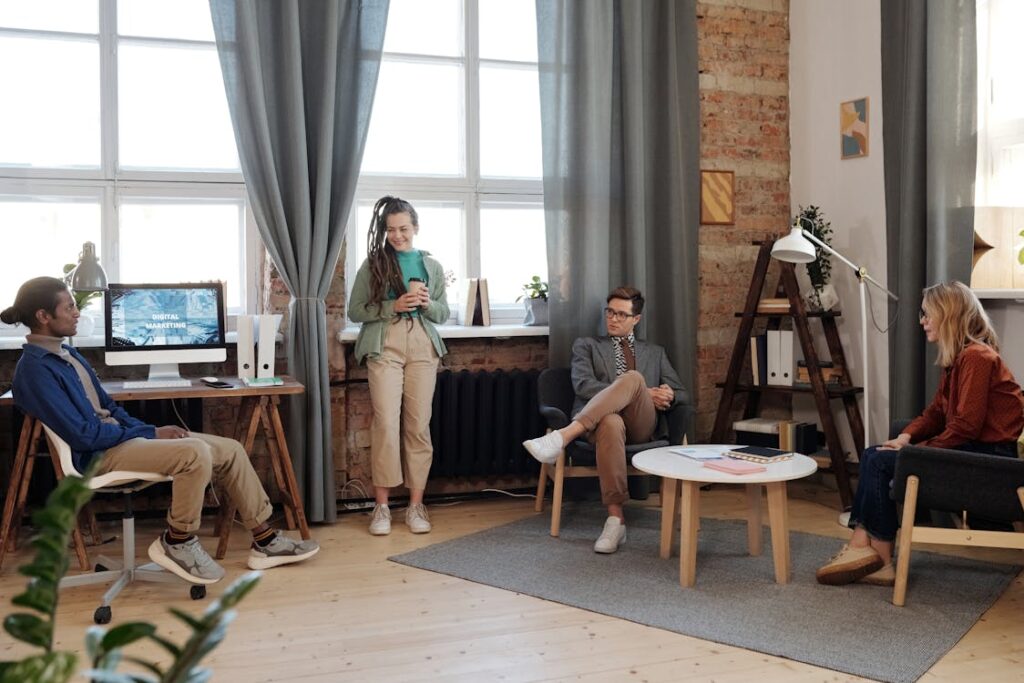 A few people in the loft-style coworking room.